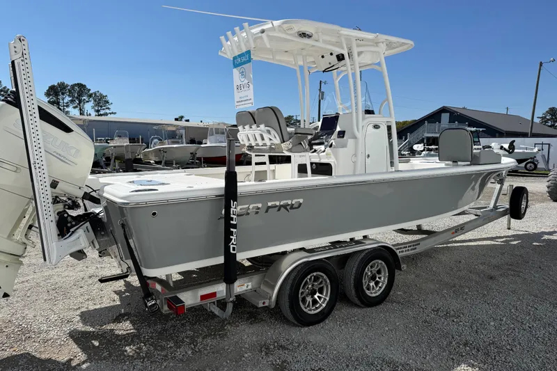 Slide: The Image of 2021 Sea Pro 248 Bay boat on trailer, displayed outdoors for sale. - 10