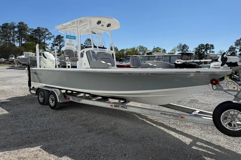 Slide: The Image of 2021 Sea Pro 248 Bay boat on trailer, displayed outdoors for sale. - 11