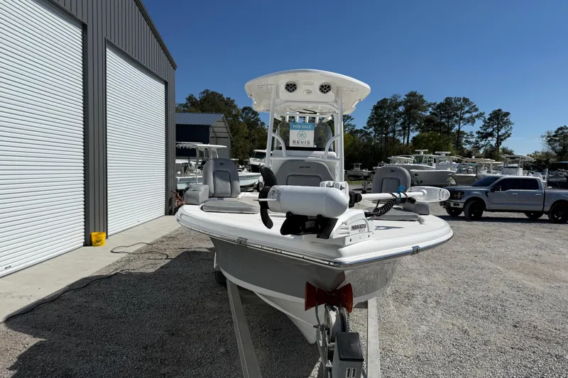 Slide: The Image of 2021 Sea Pro 248 Bay boat for sale, parked outdoors near a storage facility. - 13