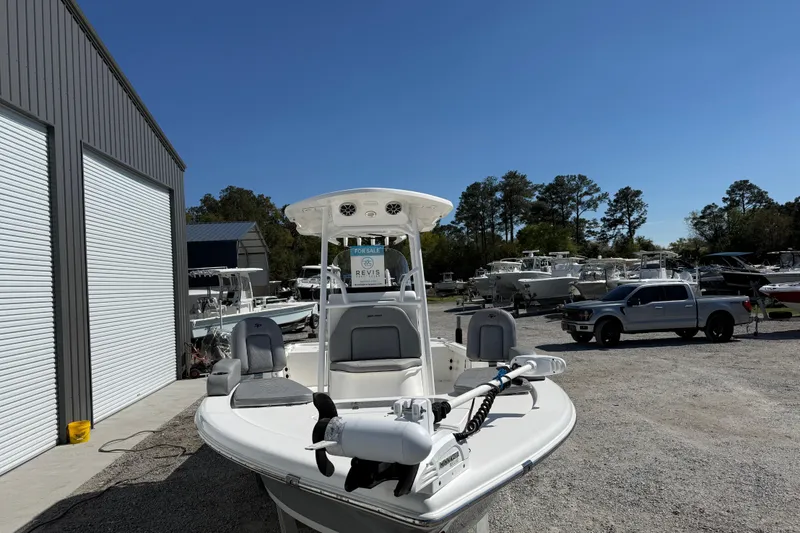 Slide: The Image of 2021 Sea Pro 248 Bay boat for sale at a dealership, parked outdoors. - 14