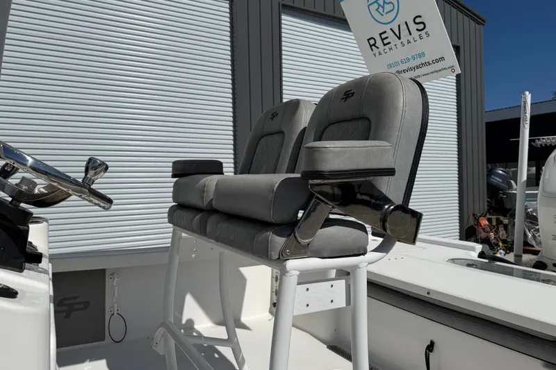 Slide: The Image of 2021 Sea Pro 248 Bay boat seats with steering wheel, displayed at Revis Yacht Sales. - 19