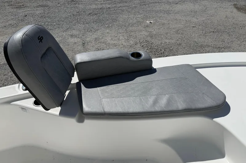 Slide: The Image of Gray seating area on a 2021 Sea Pro 248 Bay boat, featuring a cup holder. - 21