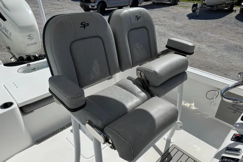 Slide: The Image of 2021 Sea Pro 248 Bay boat seats with armrests and diamond stitching detail. - 26