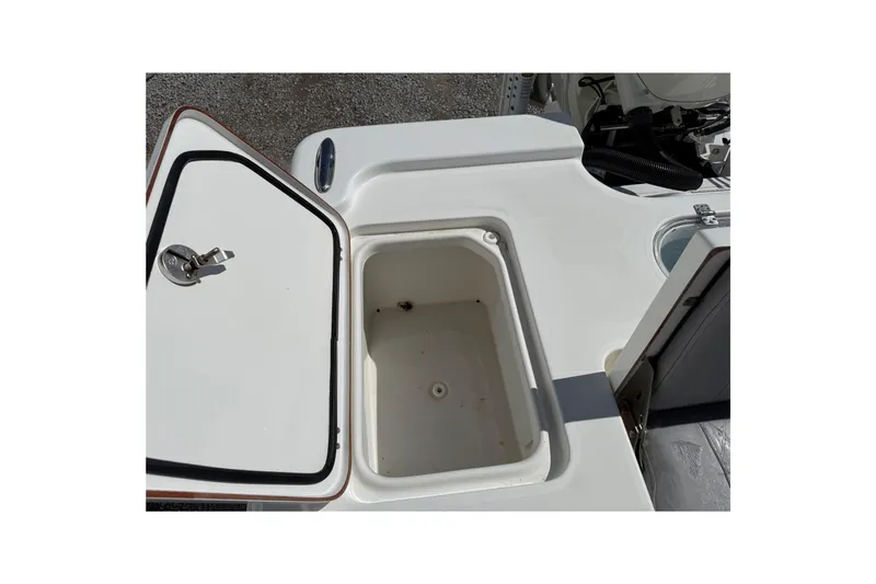 Slide: The Image of Open storage compartment on 2021 Sea Pro 248 Bay boat deck. - 29