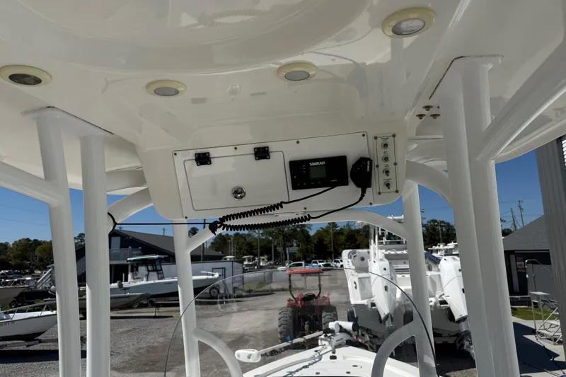 Slide: The Image of 2021 Sea Pro 248 Bay boat console with electronics and overhead storage. - 33