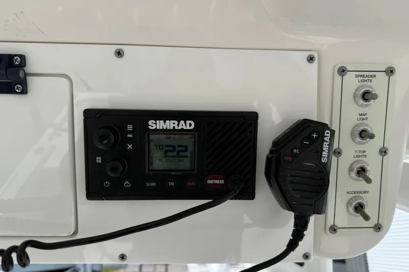 Slide: The Image of Simrad marine radio and control panel on 2021 Sea Pro 248 Bay boat. - 35
