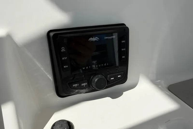 Slide: The Image of Wet Sounds audio control panel on 2021 Sea Pro 248 Bay boat dashboard. - 36
