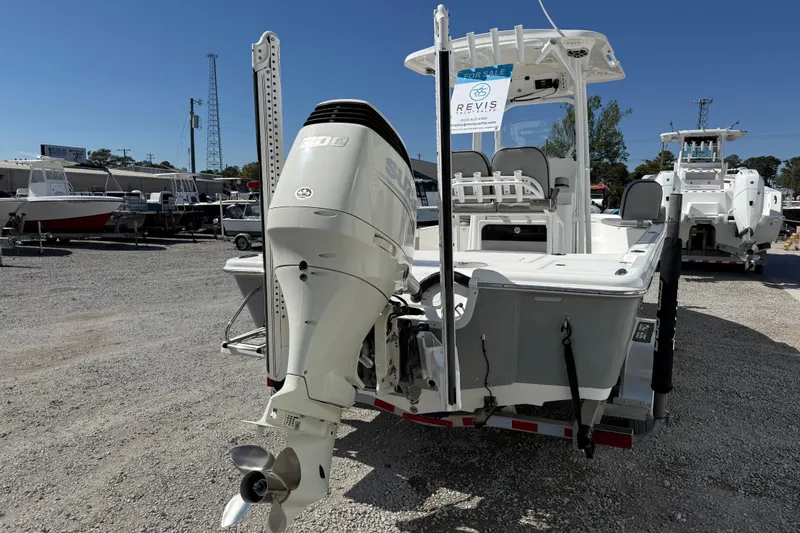 Slide: The Image of 2021 Sea Pro 248 Bay boat with powerful outboard motor, displayed for sale in a marina. - 7