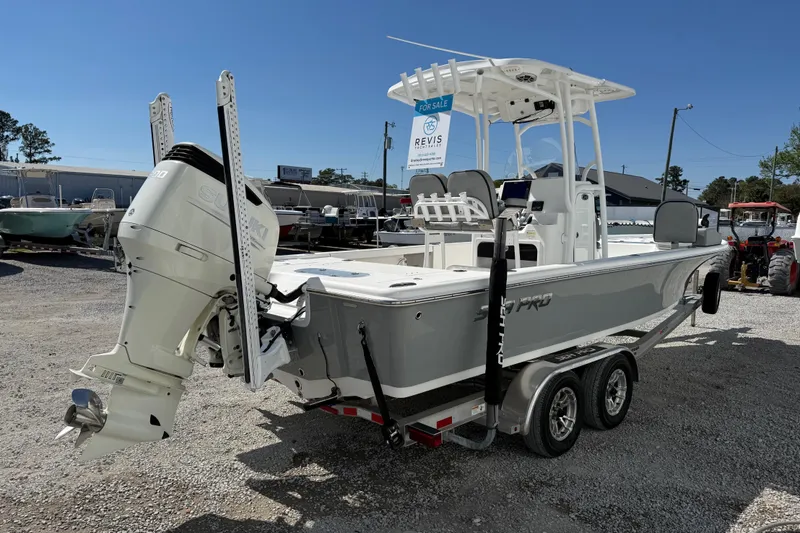 Slide: The Image of 2021 Sea Pro 248 Bay boat on trailer, featuring Suzuki outboard motor, for sale. - 9