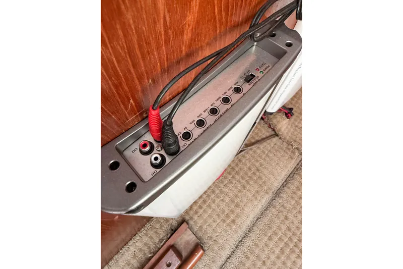 Slide: The Image of Audio control panel with cables in a 1988 Pacemaker 36 Convertible boat interior. - 102
