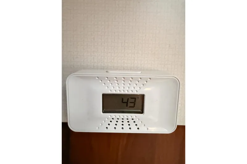 Slide: The Image of Digital thermometer displaying 43 degrees, mounted on a wall. - 105