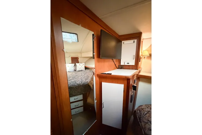 Slide: The Image of Interior of 1988 Pacemaker 36 Convertible yacht with cozy cabin and wooden cabinetry. - 106