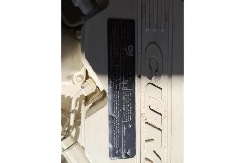 Slide: The Image of Engine detail of 1988 Pacemaker 36 Convertible boat, featuring Cummins branding. - 110