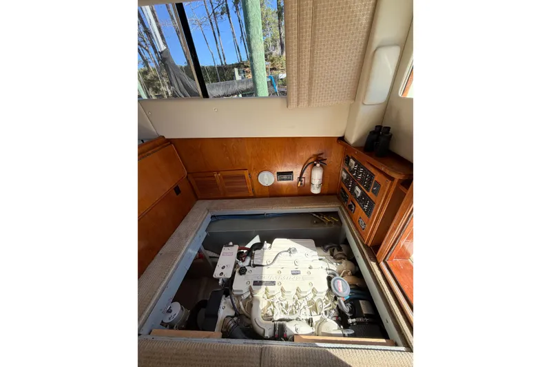 Slide: The Image of Engine room of 1988 Pacemaker 36 Convertible yacht with visible control panel and fire extinguisher. - 111