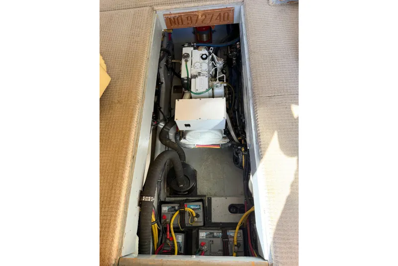 Slide: The Image of Engine compartment of a 1988 Pacemaker 36 Convertible boat, showing mechanical components. - 112