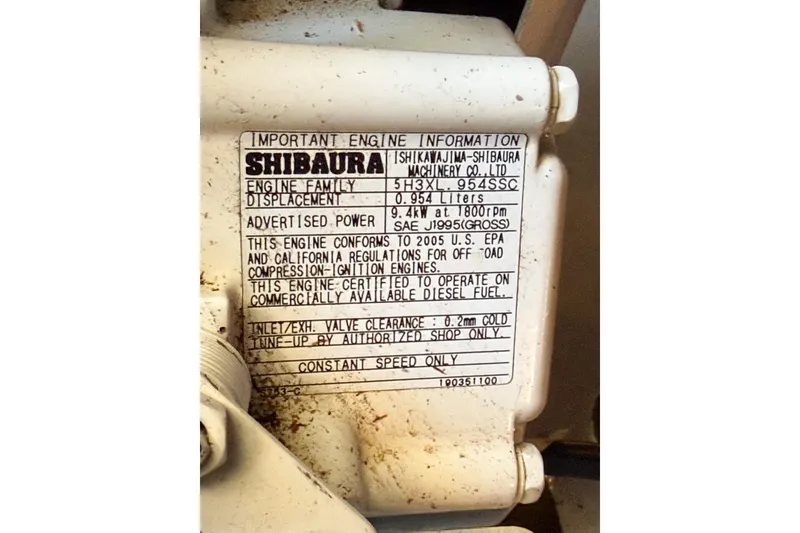 Slide: The Image of Engine information label on a 1988 Pacemaker 36 Convertible, featuring Shibaura specifications. - 114