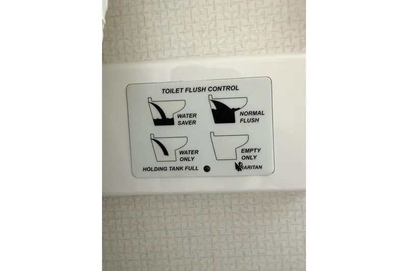 Slide: The Image of Control panel for toilet flush options on a 1988 Pacemaker 36 Convertible. - 118