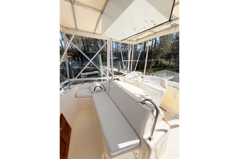 Slide: The Image of Interior view of 1988 Pacemaker 36 Convertible boat with cushioned seating and canopy. - 22