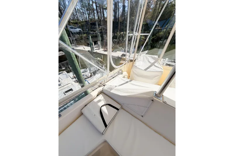 Slide: The Image of Interior view of a 1988 Pacemaker 36 Convertible boat with cushioned seating. - 23