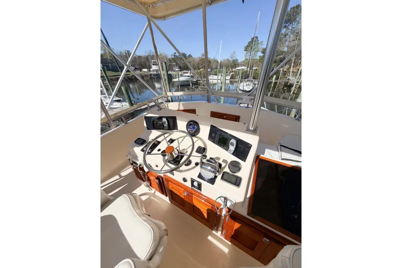 Slide: The Image of 1988 Pacemaker 36 Convertible boat helm with steering wheel and navigation instruments. - 28