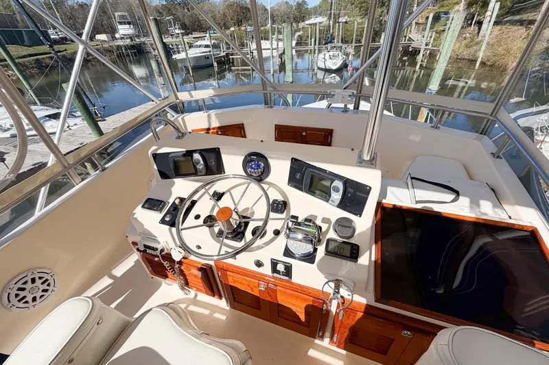 Slide: The Image of 1988 Pacemaker 36 Convertible yacht helm with steering wheel and navigation instruments. - 29