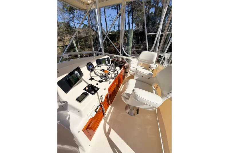 Slide: The Image of Cockpit of 1988 Pacemaker 36 Convertible boat with steering wheel and navigation instruments. - 31