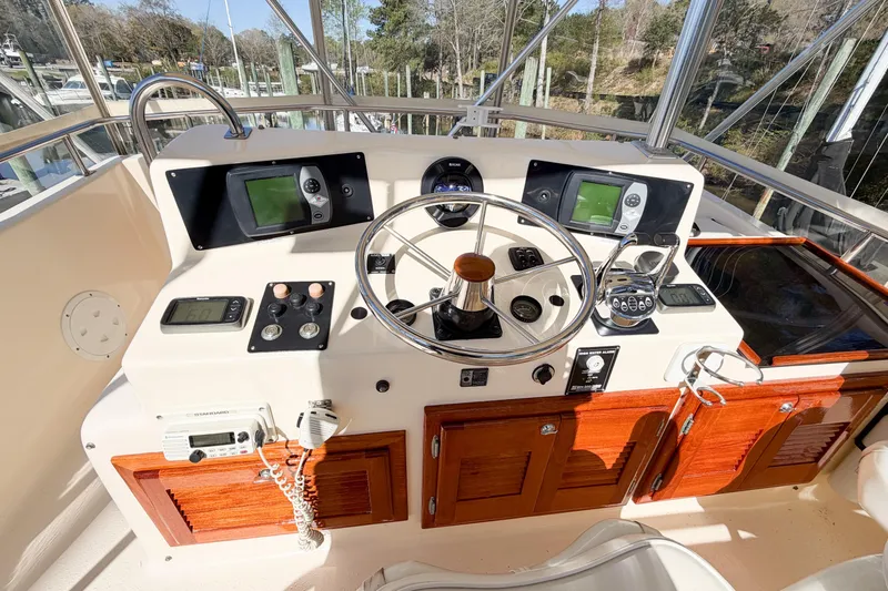 Slide: The Image of Helm of 1988 Pacemaker 36 Convertible yacht with steering wheel and navigation instruments. - 32