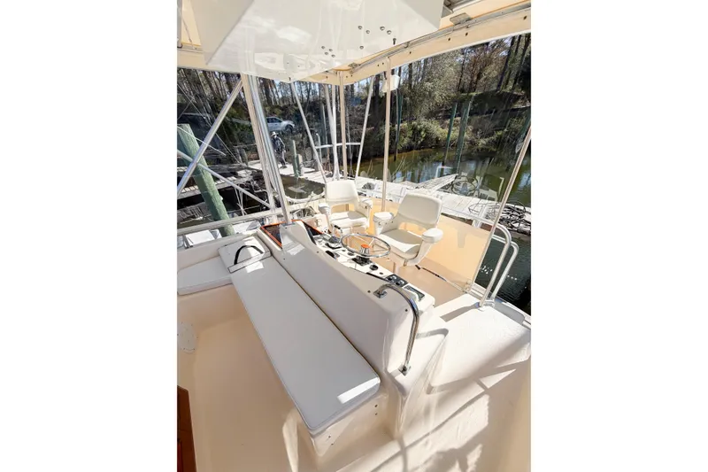 Slide: The Image of Interior view of 1988 Pacemaker 36 Convertible boat with seating and steering area. - 34