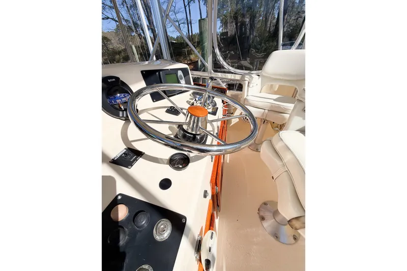 Slide: The Image of Helm of 1988 Pacemaker 36 Convertible boat with steering wheel and controls. - 36