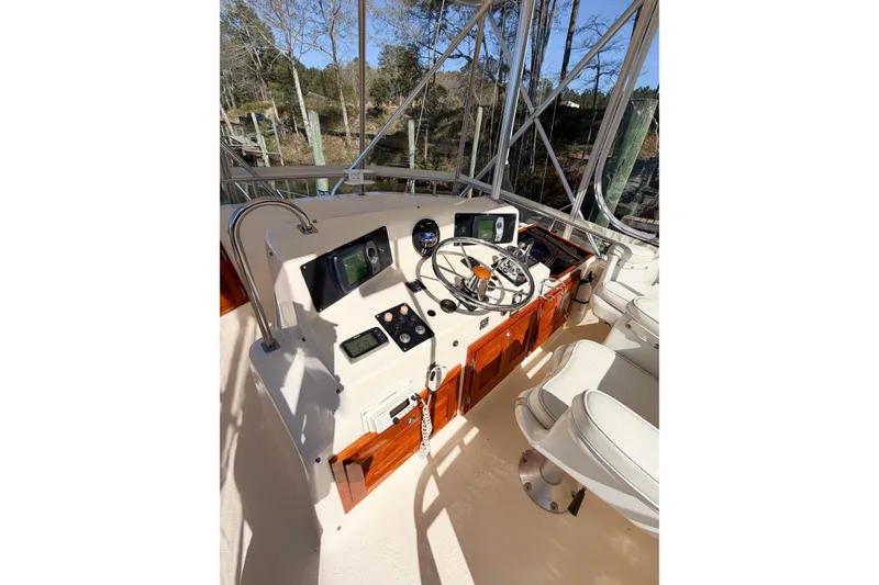 Slide: The Image of Helm of 1988 Pacemaker 36 Convertible boat with steering wheel and navigation equipment. - 37