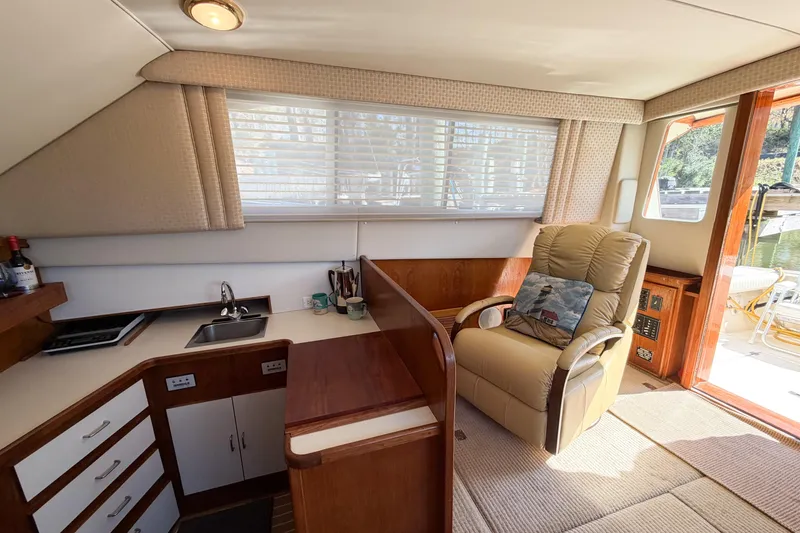 Slide: The Image of Interior of 1988 Pacemaker 36 Convertible yacht with cozy seating and kitchenette. - 51