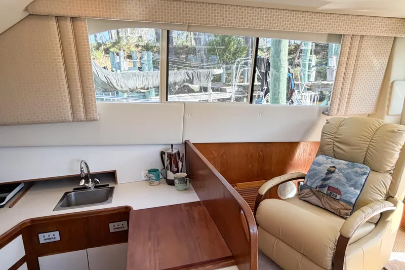 Slide: The Image of Interior of 1988 Pacemaker 36 Convertible yacht with cozy seating and kitchenette. - 53