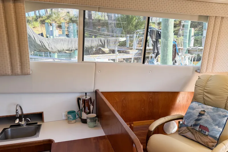 Slide: The Image of Interior of 1988 Pacemaker 36 Convertible yacht with cozy seating and kitchenette. - 54