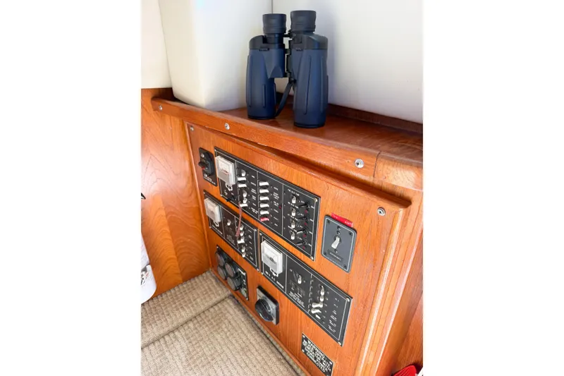 Slide: The Image of Control panel and binoculars on 1988 Pacemaker 36 Convertible boat. - 55