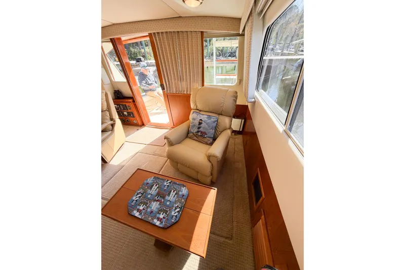 Slide: The Image of Interior of 1988 Pacemaker 36 Convertible yacht with comfortable seating and natural light. - 63
