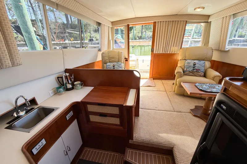 Slide: The Image of Interior of 1988 Pacemaker 36 Convertible yacht with cozy seating and kitchenette. - 69