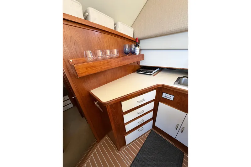 Slide: The Image of 1988 Pacemaker 36 Convertible yacht interior with wooden cabinetry and countertop. - 74