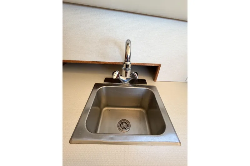 Slide: The Image of Stainless steel sink with faucet in 1988 Pacemaker 36 Convertible boat. - 76