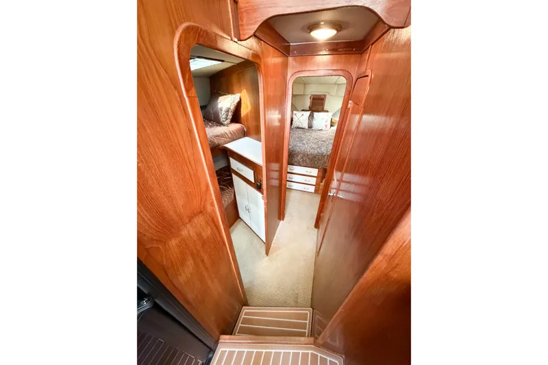 Slide: The Image of Interior of 1988 Pacemaker 36 Convertible yacht with wood paneling and cozy cabin. - 80