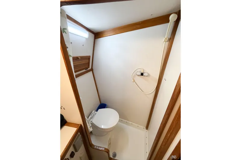 Slide: The Image of Compact bathroom in 1988 Pacemaker 36 Convertible boat with shower and toilet. - 88