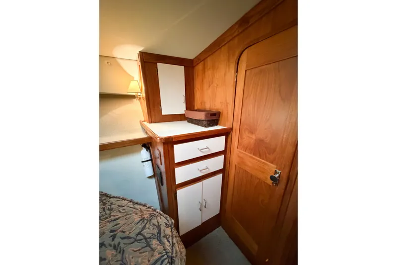 Slide: The Image of Interior of 1988 Pacemaker 36 Convertible with wooden cabinetry and cozy lighting. - 98