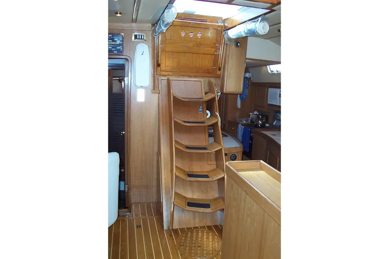 Slide: The Image of Interior of 1994 C&C 51' XL / CB yacht with wooden stairs and cabinetry. - 12