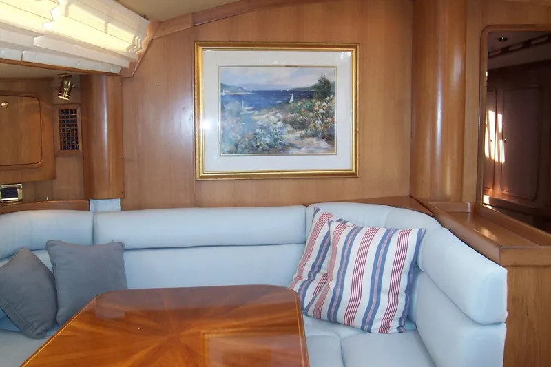 Slide: The Image of Luxurious 1994 C&C 51' XL yacht interior with cozy seating and nautical artwork. - 15