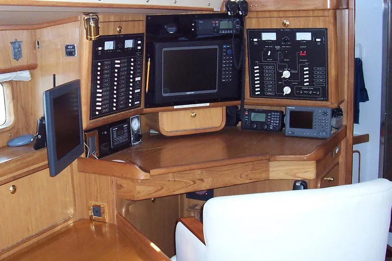Slide: The Image of Navigation station of a 1994 C&C 51' XL / CB yacht with control panels and electronics. - 19