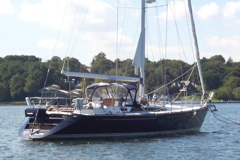 Slide: The Image of Sailing yacht C&C 51' XL / CB, 1994 model, anchored on a serene lake. - 2