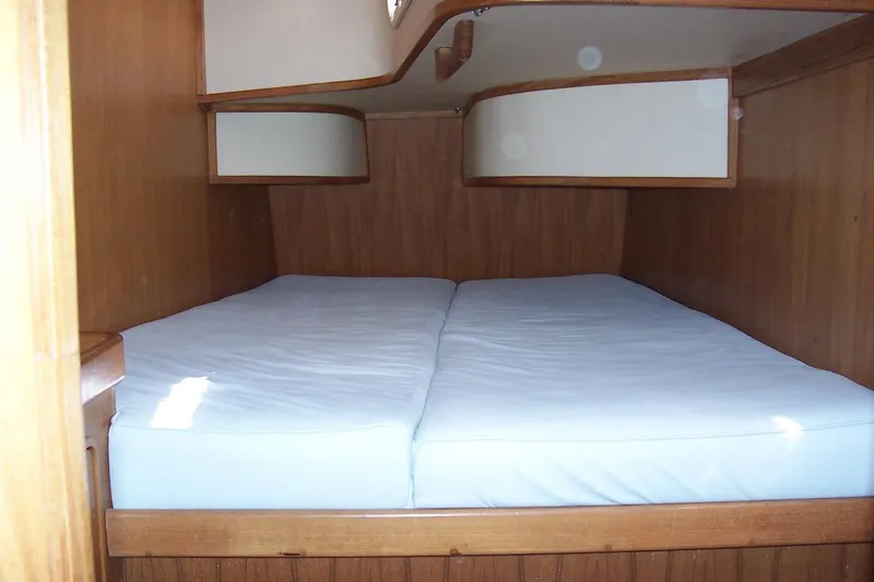 Slide: The Image of Cozy cabin interior of 1994 C&C 51' XL / CB sailboat with wooden finish and double bed. - 24