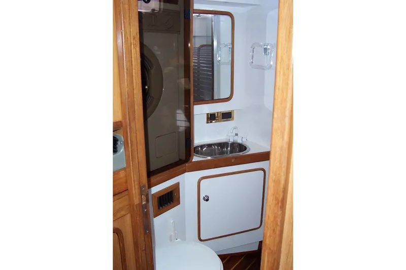 Slide: The Image of Interior of 1994 C&C 51' XL / CB yacht bathroom with sink and mirror. - 25