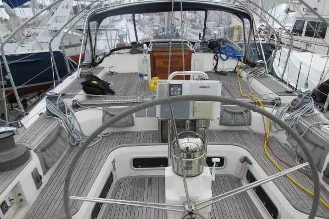 Slide: The Image of Cockpit view of a 1994 C&C 51' XL / CB sailboat, featuring steering wheel and deck equipment. - 32