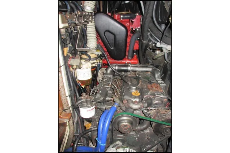 Slide: The Image of Engine compartment of a 1994 C&C 51' XL / CB sailboat, showcasing mechanical components. - 33