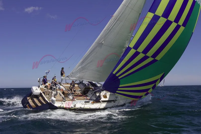 Slide: The Image of Sailing yacht C&C 51' XL / CB 1994 with colorful spinnaker on open sea. - 35